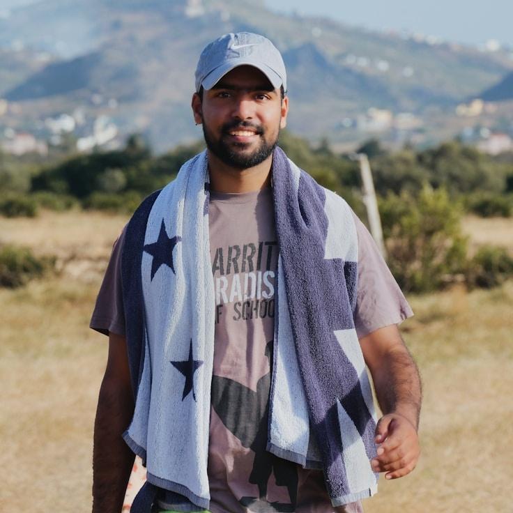 Amina Rao, Lead Design Curator at Garden Orchard Grove, reviewing corporate floral arrangements